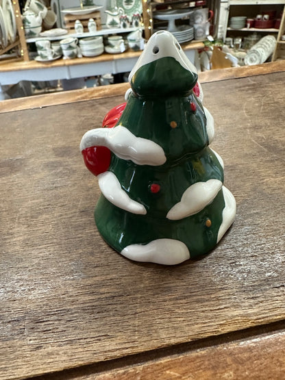 Ceramic Christmas shaker shaped like a green tree with red accents and white hands