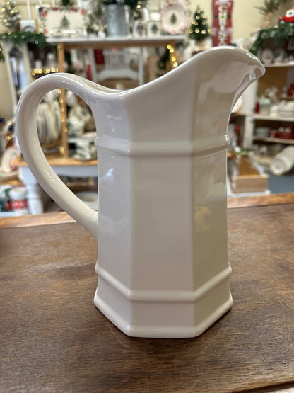 White ceramic heritage pitcher with curved handle and spout