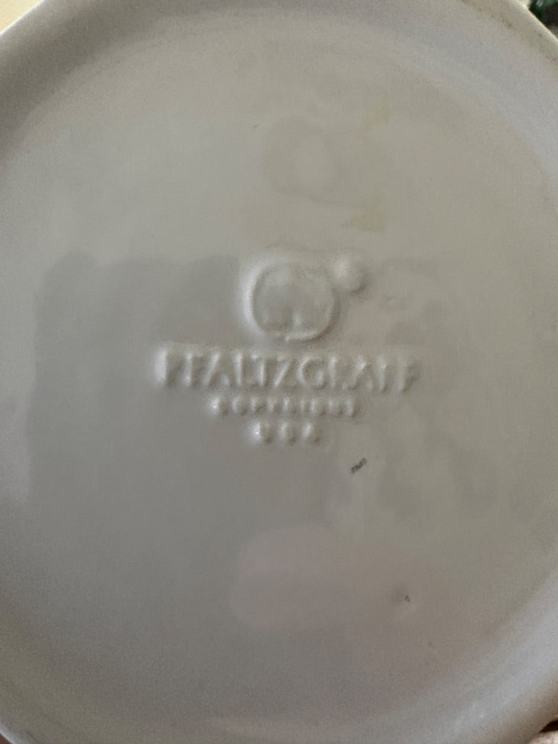 Embossed maker mark on underside of white ceramic pitcher base
