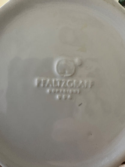 Embossed maker mark on underside of white ceramic pitcher base