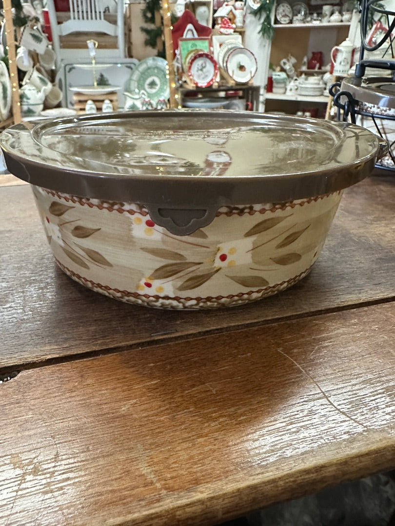 Lidded ceramic baker with loop handles, beige with brown and tan floral accents
