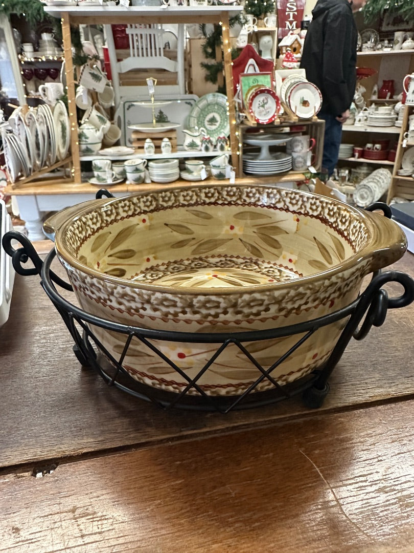 Brown patterned baking dish with side handles on metal wire rack