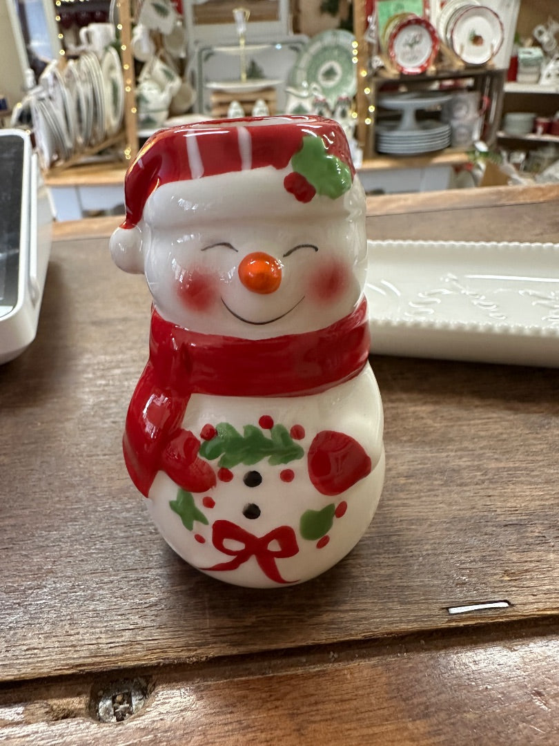 White holiday tray with embossed pattern and red-and-white snowman toothpick holder