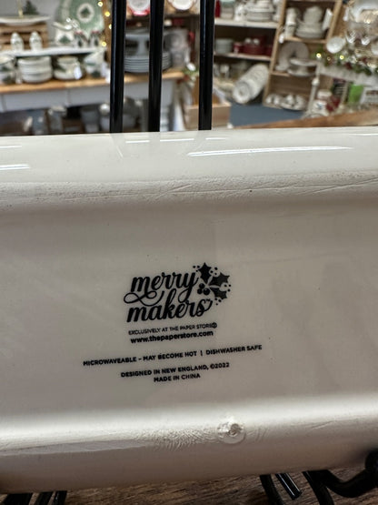 White oval tray underside with 'merry makes' logo and microwave- and dishwasher-safe text