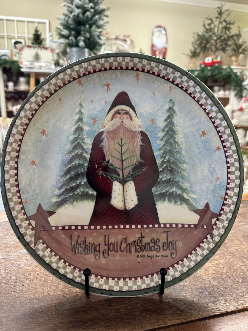 Decorative Christmas plate with Santa in front of trees and 'Wishing You Christmas Joy!'