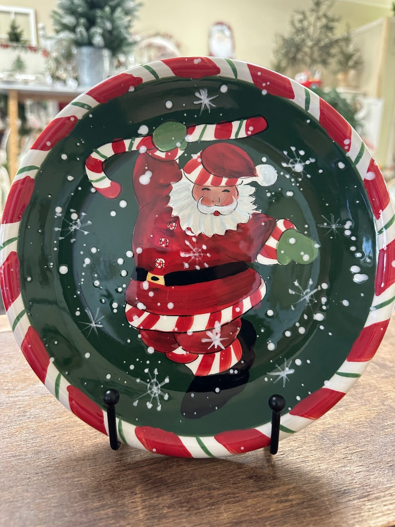 Decorative Christmas Santa plate with dancing Santa graphic in red and green