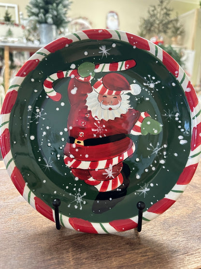 Decorative Christmas Santa plate with dancing Santa graphic in red and green