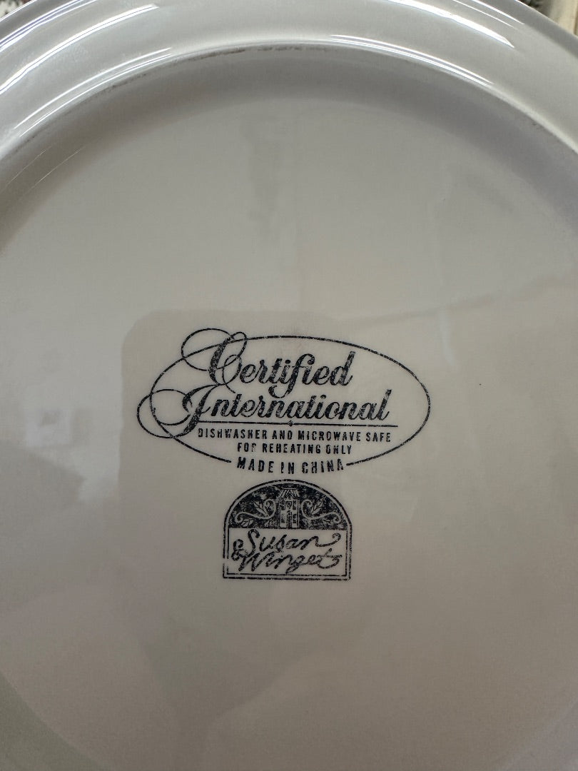 Bottom of white plate showing Certified International and Susan Williams marks