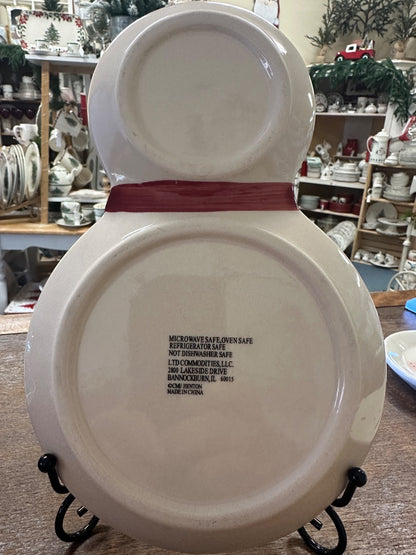 Snowman ceramic plate, underside view with microwave-safe text