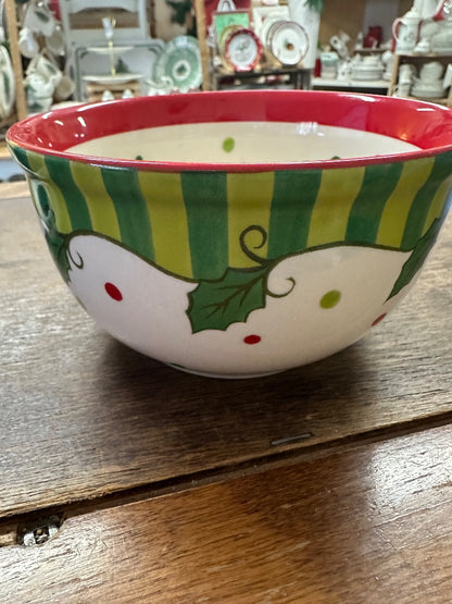 Small ceramic bowl with red rim, green striped sides, holly leaves and dotted accents