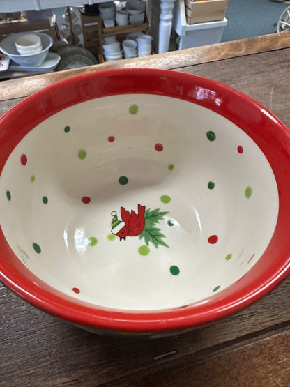 Small ceramic bowl with red rim; white interior with green dots and red cardinal motif
