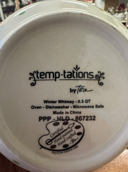 Bottom of ceramic bowl with Temptations by Tara logo and oven-safe and Made in China text