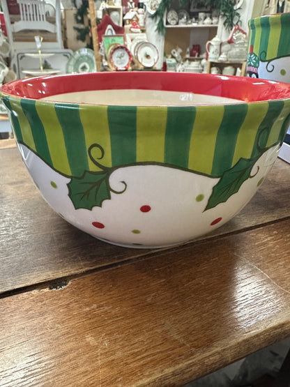 Round ceramic bowl with green striped band, red rim, and holly and snowman graphics