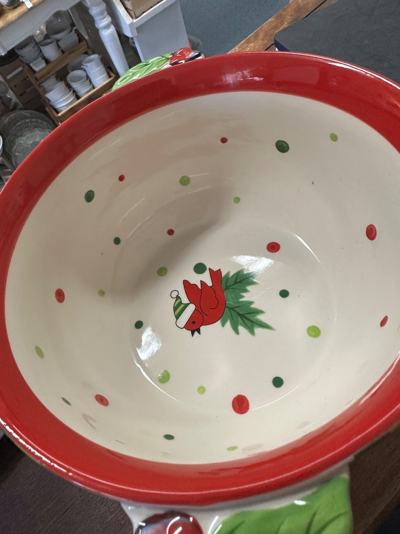 Large ceramic bowl with red outer rim and central cardinal in festive dot pattern