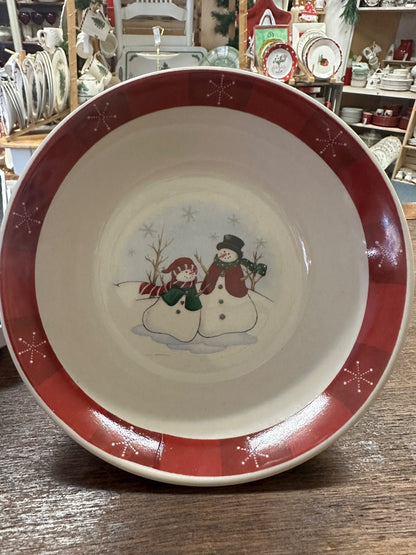 Decorative red-rim ceramic bowl with white interior and snowman couple graphic