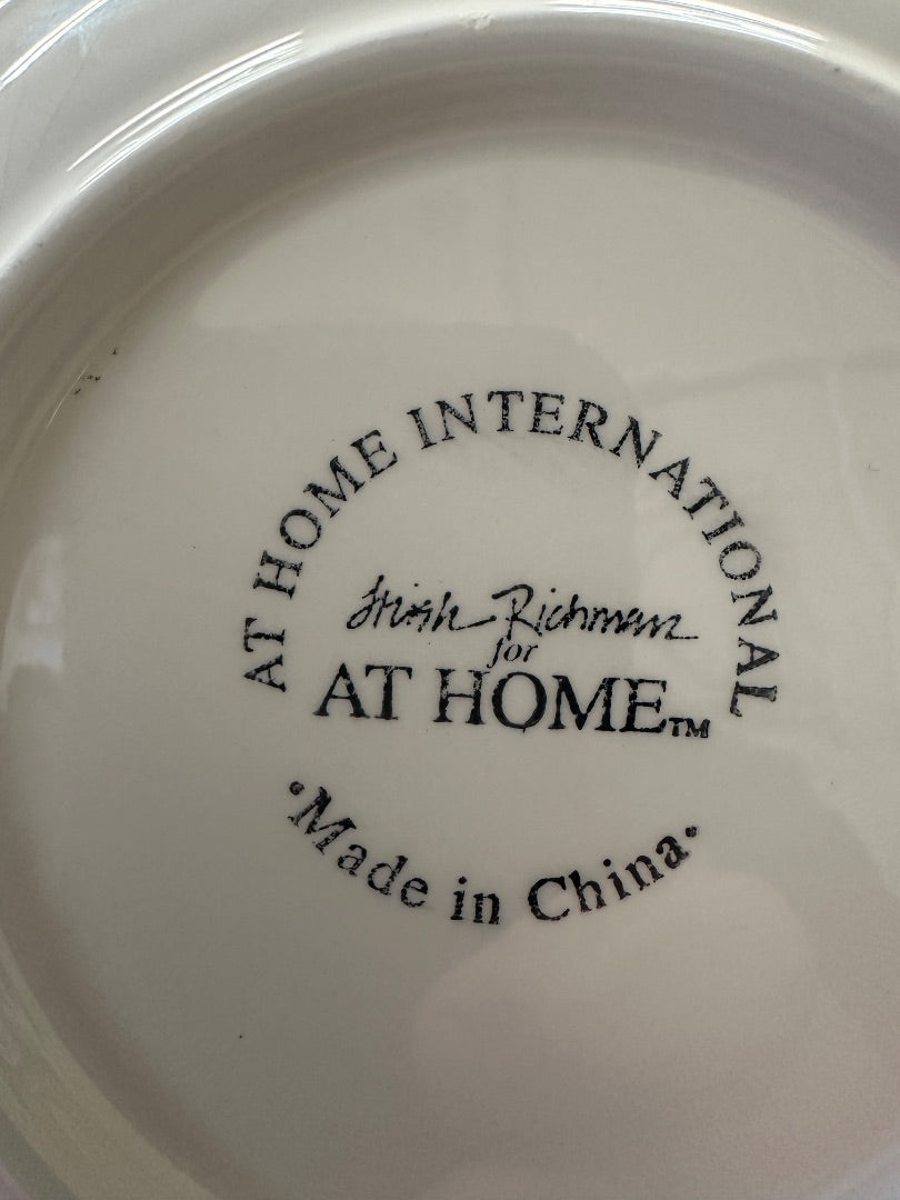 At Home International plate bottom text: 'AT HOME' and 'Made in China'