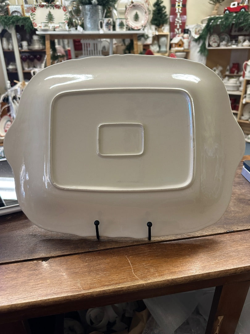 White ceramic platter with raised center panel and curved carry handle