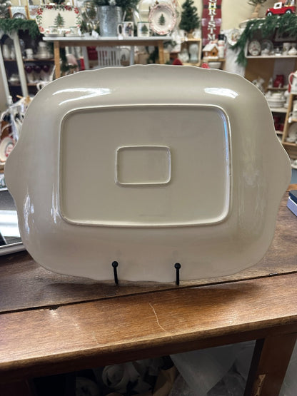 White ceramic platter with raised center panel and curved carry handle