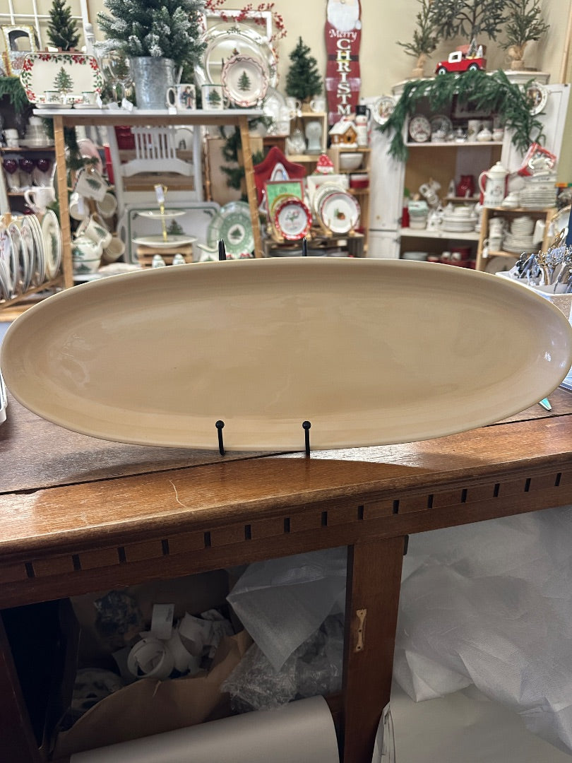 Yellow oval serving platter with raised rim