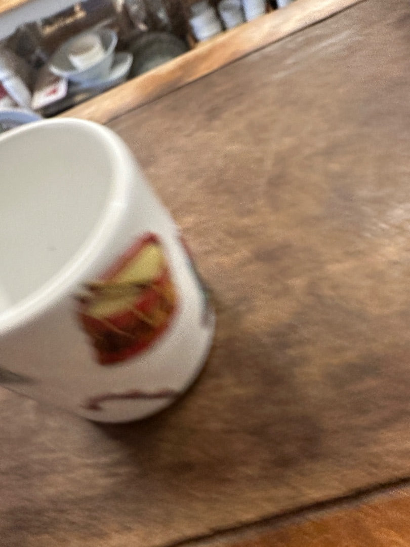 White Christmas mug with small toy drum print, partial view