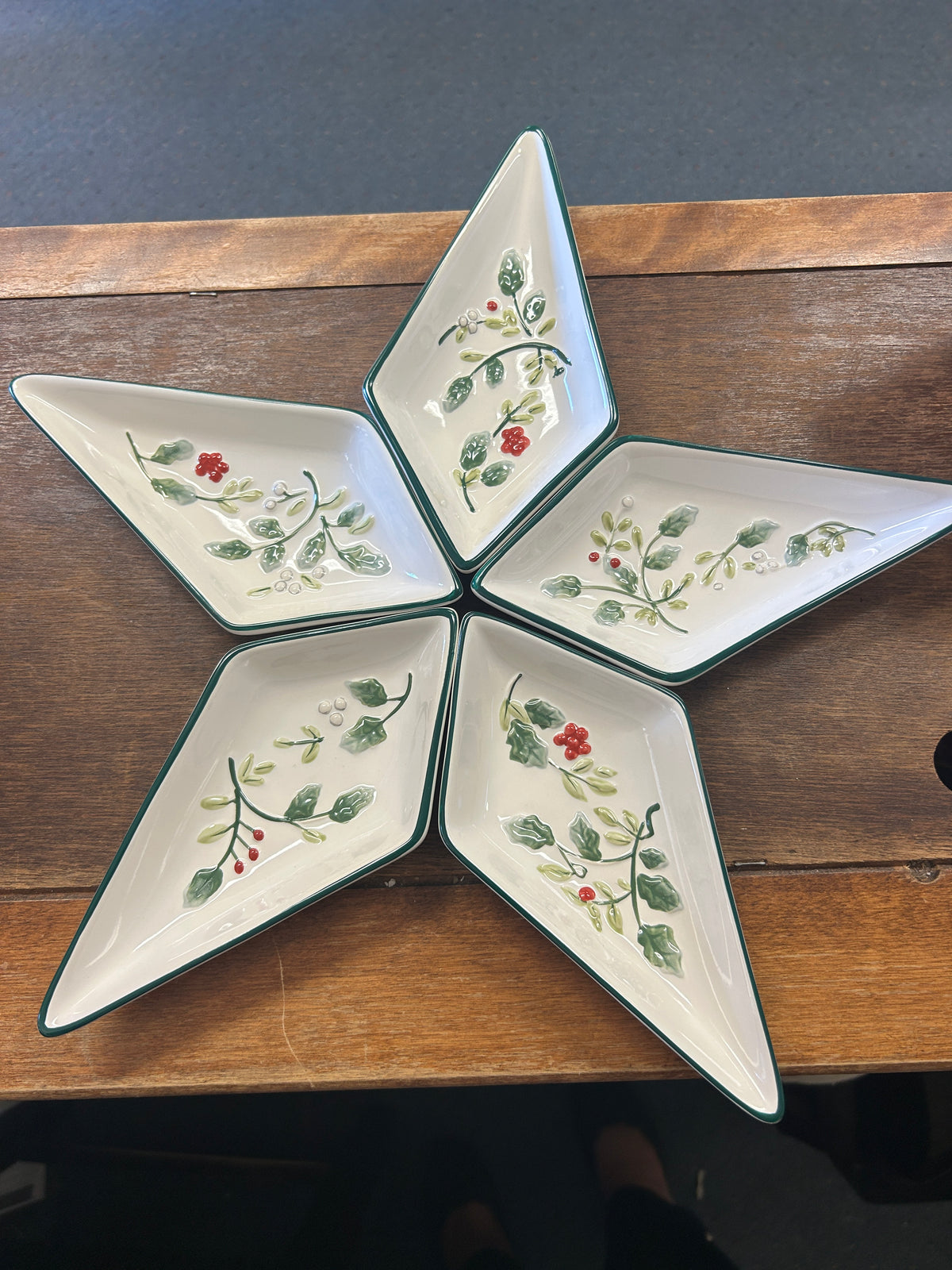 Star-shaped ceramic bowl set with Winterberry-style green and red botanical pattern