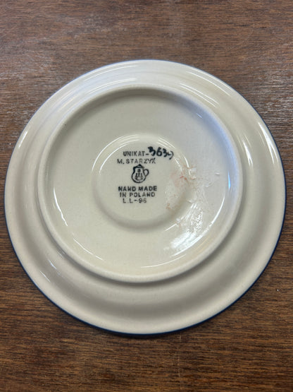 Back of ceramic plate with UNIKAT stamp and handmade marking on base