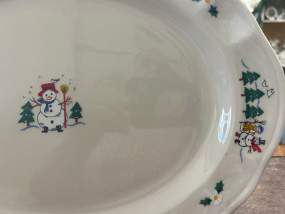 Ceramic oval serving platter with snowman artwork and small tree-and-star accents