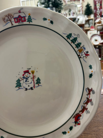 11-inch dinner plate with snowman, pine trees, and Christmas village details on rim