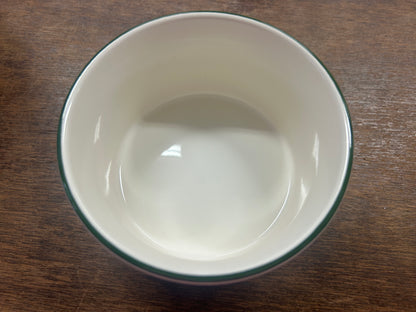 White ceramic bowl interior with glossy finish and green rim