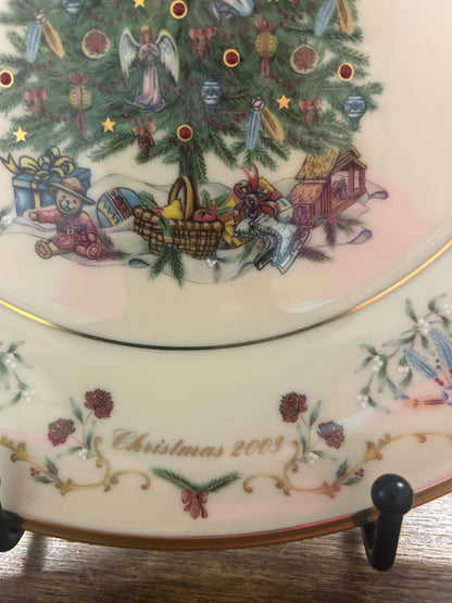 Christmas plate edge showing “Christmas 2003” text with illustrated holiday village scene