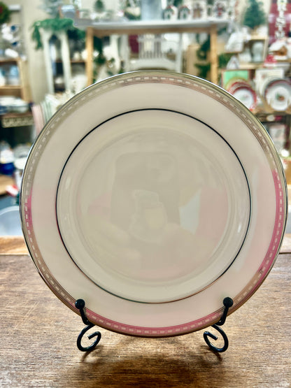 White bread plate with silver-tone rim, pink stripe, and black inner ring