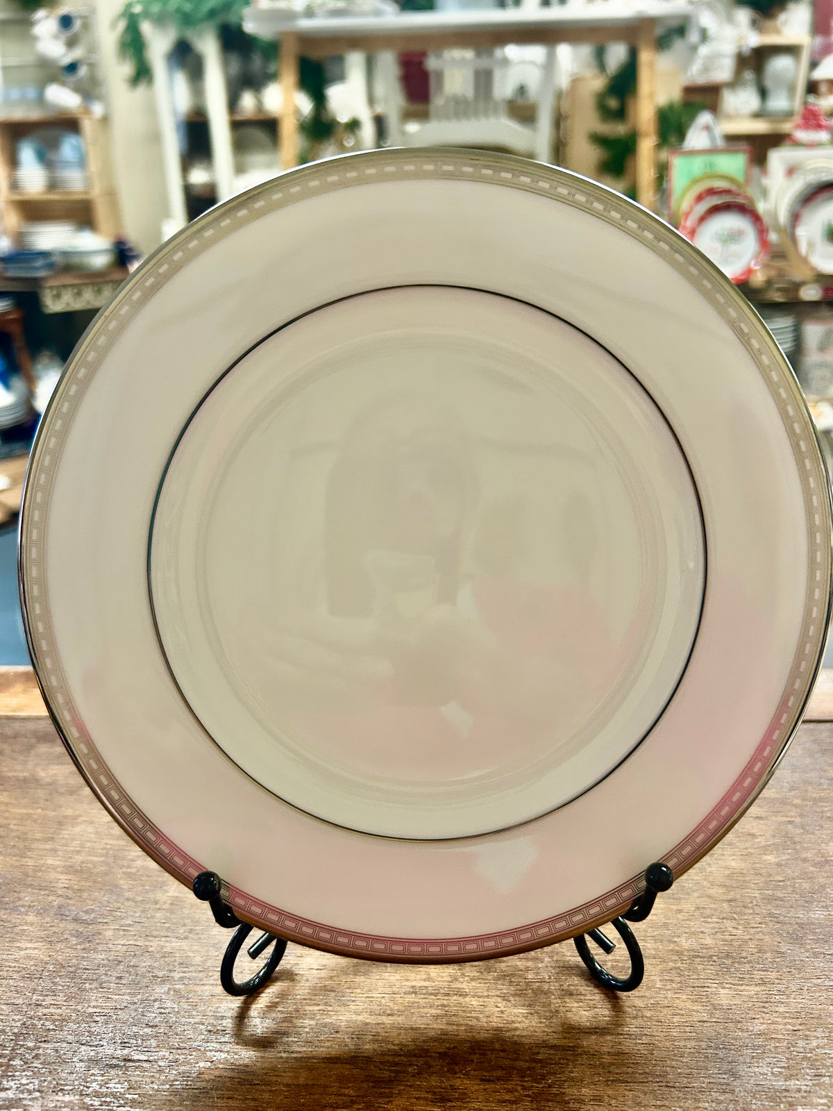 Cream salad plate with silver rim, thin red edge line, and dark inner border