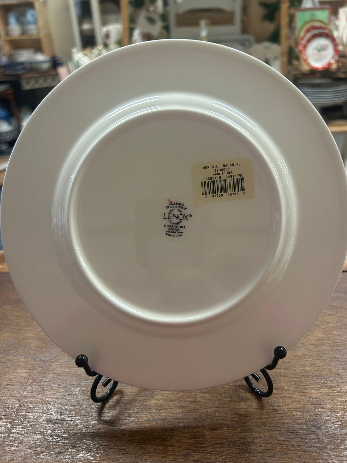 Back of cream Lenox salad plate with stamp, barcode sticker, and stand