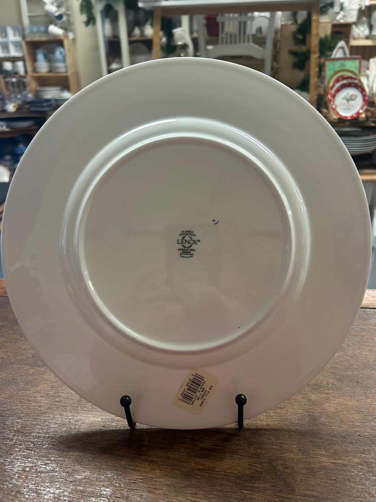 White ceramic dinner plate underside with maker stamp and barcode label
