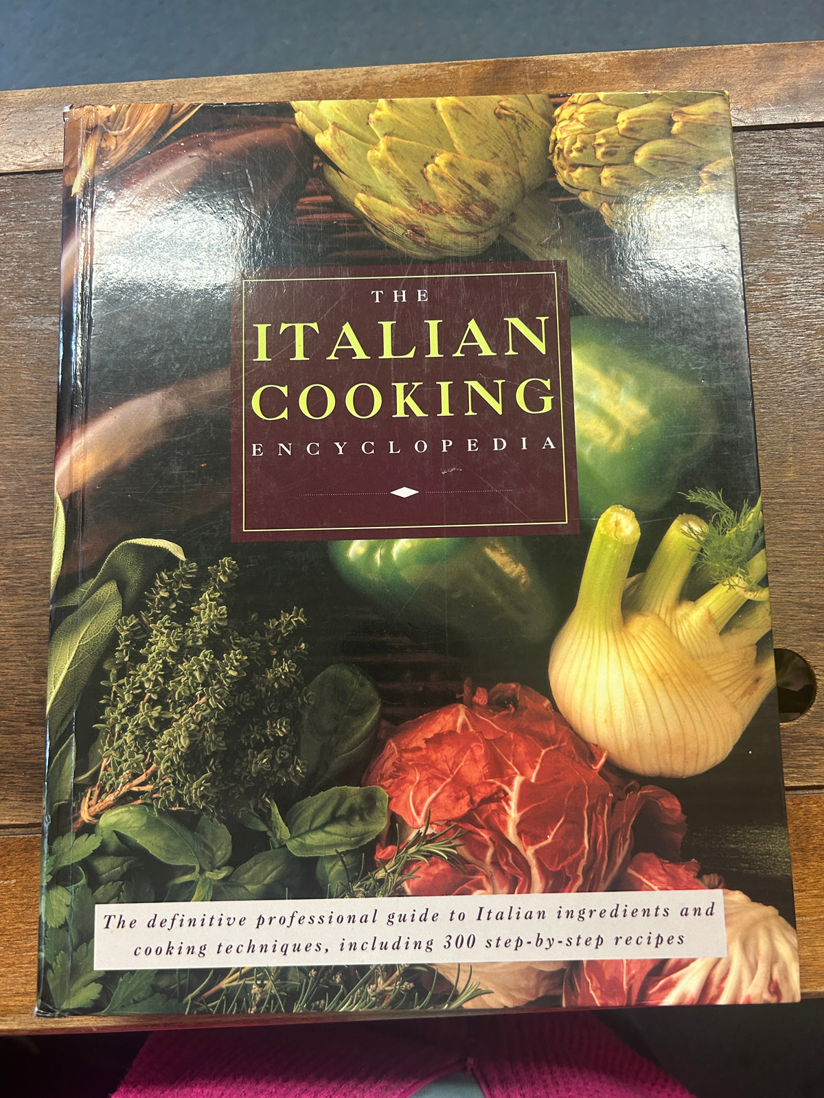 Hermes Italian cooking encyclopedia book cover with colorful food illustrations and title
