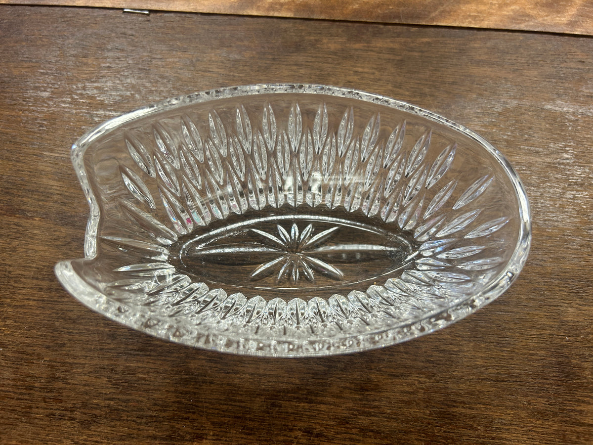 Clear crystal silverware holder bowl with ornate rim and starburst center