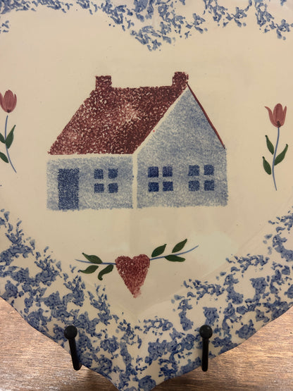 Heart-shaped sponge platter with blue speckled edges, red house, and blue heart accents.