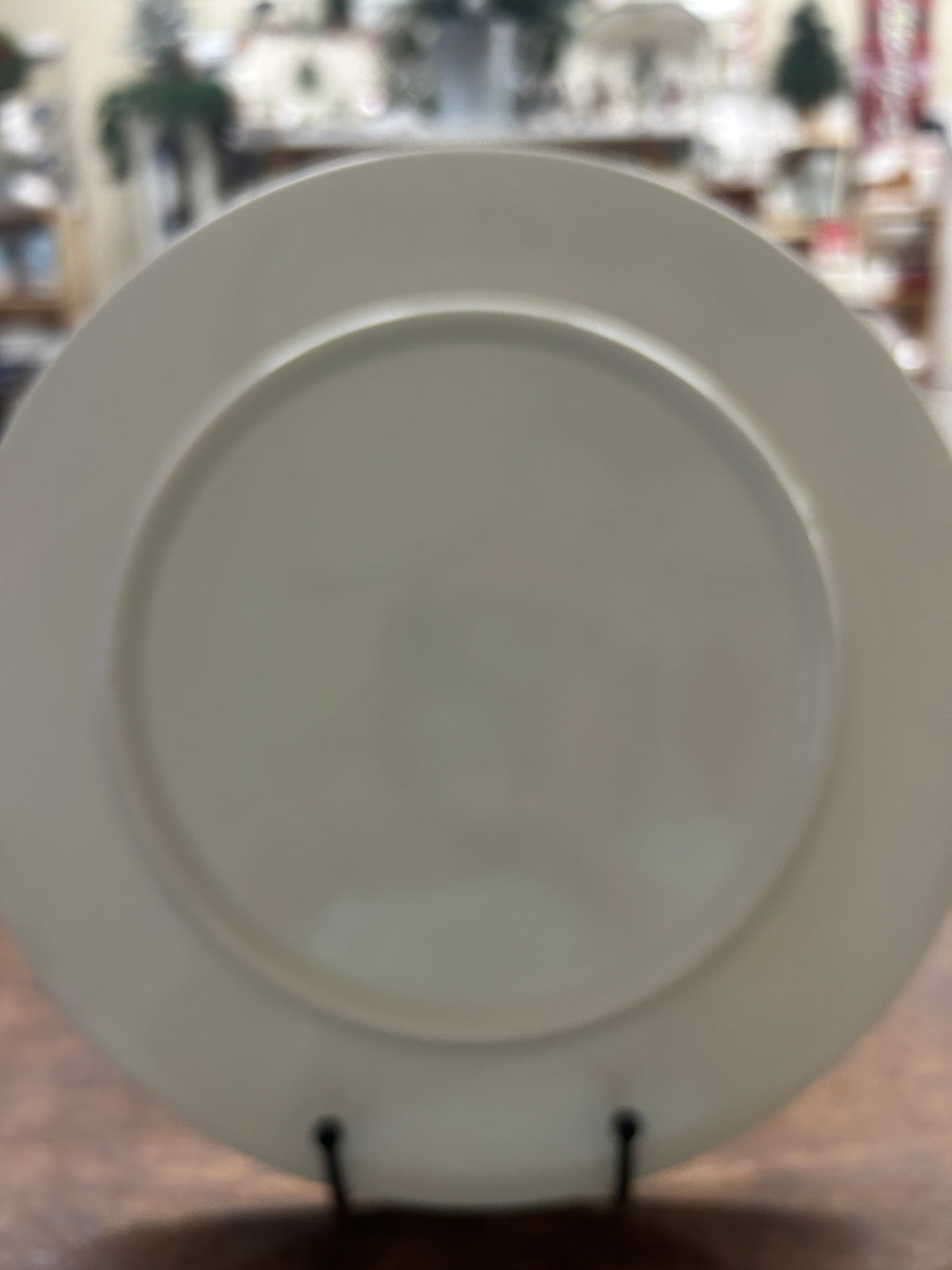 12-inch white platter back with raised center and two display feet