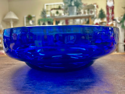 Cobalt blue footed bowl with glossy finish and rounded rim