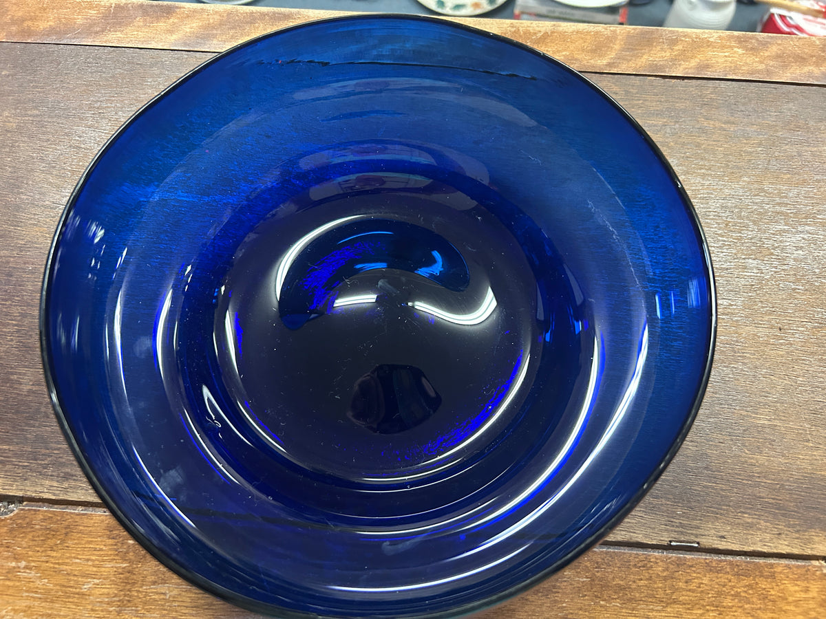 Cobalt blue bowl top view with centered base and glossy reflective interior