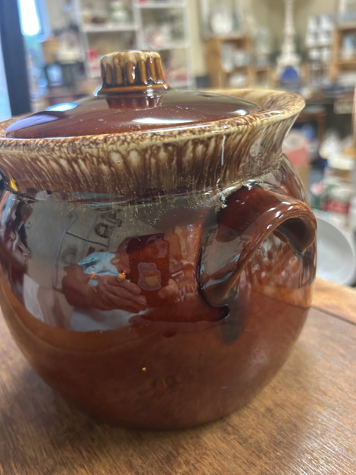 Brown drip bean pot with lid, handles, and speckled glaze, 7 in