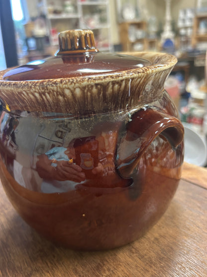 Brown drip bean pot with lid, handles, and speckled glaze, 7 in