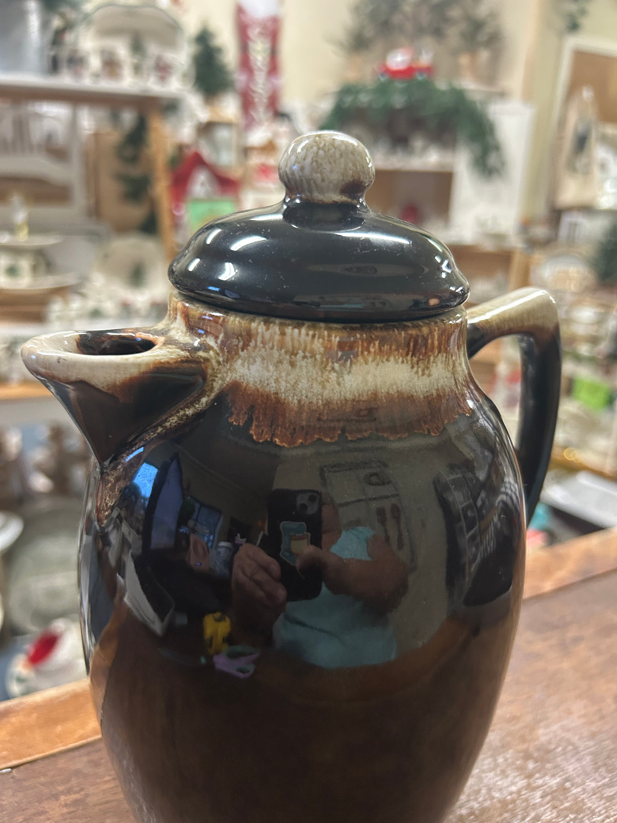 Brown ceramic drip coffee pot with dark teal lid and wide spout openings
