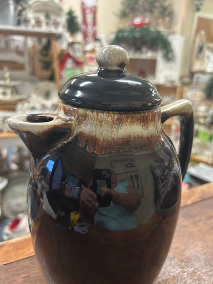 Brown ceramic drip coffee pot with dark teal lid and wide spout openings