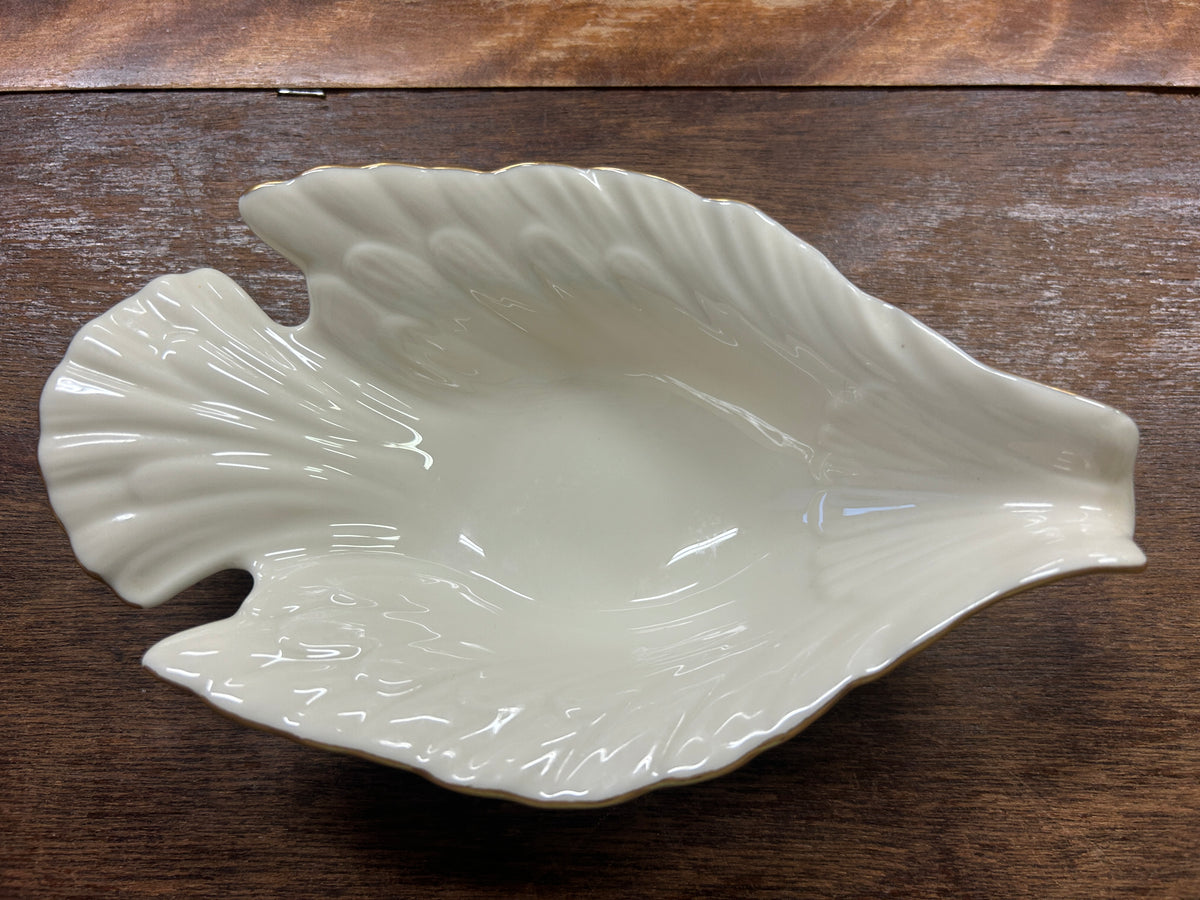 Cream Lenox dove-shaped serving bowl with gold edge detailing.