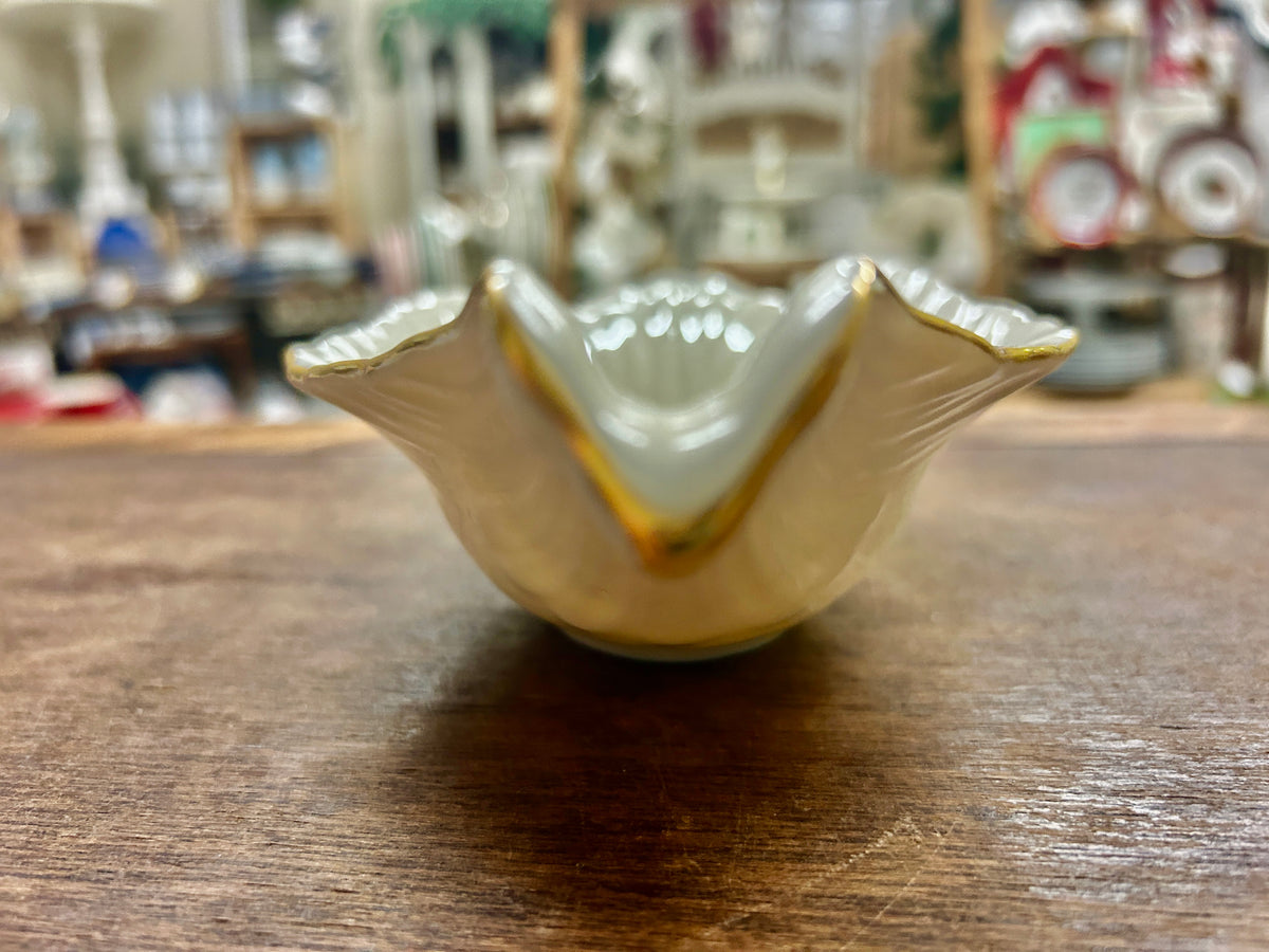 Cream Lenox dove bird bowl with gold trim, angled view.