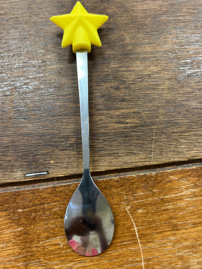 Tall yellow star topper on silver spoon with oval bowl