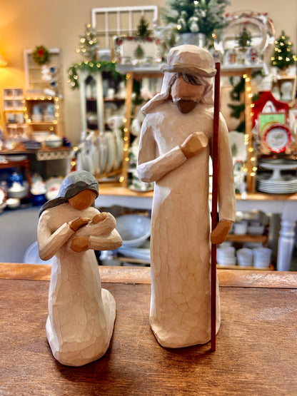 Cream nativity figurines: Mary holding baby and Joseph standing, hand-carved wood look