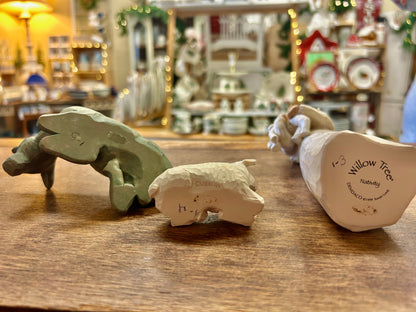 Three-piece Willow Tree nativity figurines with branded box on wooden tabletop