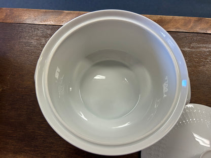 White casserole dish interior with circular center and raised rim